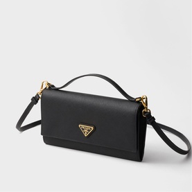 Prada black saffiano leather mini bag with top handle, gold-tone triangle logo hardware and detachable crossbody strap