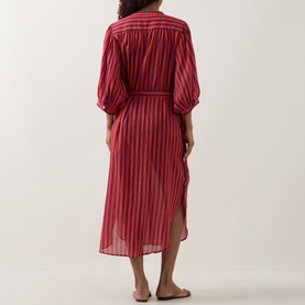 Model wearing Sea Level Vacay Boho Striped Shirt Dress in Spice Red, rear view, showing balloon sleeves, belted waist and curved hem.