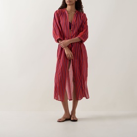 Model wearing Sea Level Vacay Boho Striped Shirt Dress in Spice Red, midi length with V-neckline and balloon sleeves, styled with flat sandals.