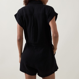 Model wearing Sea Level Sunset Textured Playsuit in black cheesecloth, elasticated waist with drawstring, short sleeves, above-the-knee length