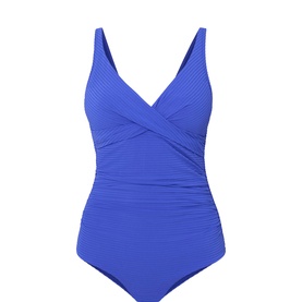 Sea Level cobalt blue one-piece swimsuit with crossover V-neckline, ruched waist panel, and textured ribbed fabric finish.
