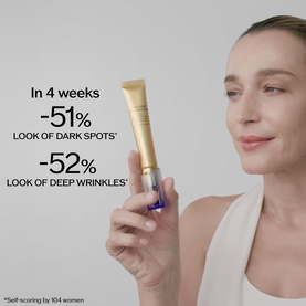 Model with Shiseido retinoid treatment tube, holding product near face, with on-screen claims for reduced dark spots and wrinkles.