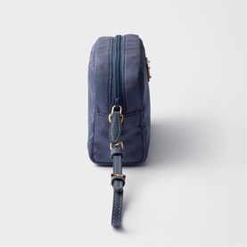 Prada Accessories blue nylon cosmetics pouch with gold-tone zip pulls and wrist strap, side profile view