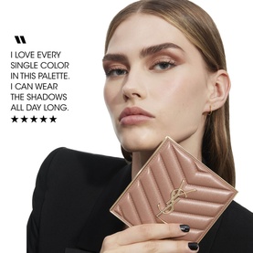 Model carrying a quilted blush pink Saint Laurent wallet with gold YSL logo hardware, styled with a five-star customer review overlay.
