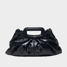Maje black patent leather clutch bag with ruched body, structured top handle, and gold-tone hardware detail