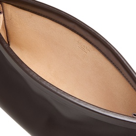 Alaia Le Click Small Shoulder Bag in Marron Fonce, interior view showing smooth leather lining and curved silhouette