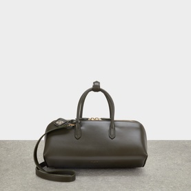Alaia Vert Camouflage calf leather barrel tote with knotted top handles, gold-tone hardware, and detachable shoulder strap