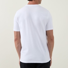 Model wearing Arne Essential Solid T-Shirt in white. Crew neck, short sleeves, straight hem. Rear view.