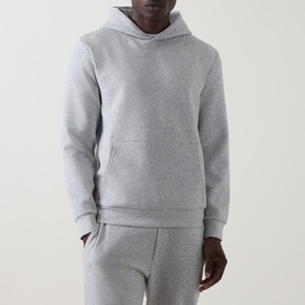 Model wearing Arne Essential Solid Hoodie in Marl Grey with kangaroo pocket and ribbed trims, styled with matching grey joggers.
