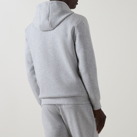 Model wearing Arne Essential Solid Hoodie in Marl Grey, back view, styled with matching joggers.