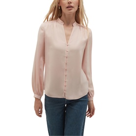 Model wearing Hobbs blush pink long sleeve button-front blouse with V-neckline and blouson cuffs, styled with blue jeans