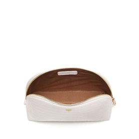 Aspinal of London Chalk White quilted cosmetics pouch, open to reveal tan interior, gold-tone zip hardware