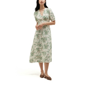 Model wearing Hobbs ivory multi floral print midi dress with puff sleeves and V-neckline, styled with tan flat shoes