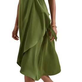 Model wearing Phase Eight green satin midi dress with draped ruffle detail, styled with a gold bracelet