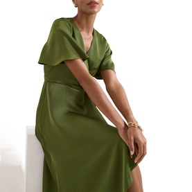 Model wearing Phase Eight green satin midi dress with draped collar and short flutter sleeves, styled with a gold chain bracelet