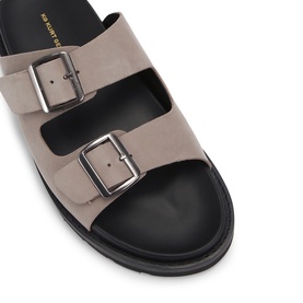 KG by Kurt Geiger men's white nubuck double-buckle sandals with black chunky sole, silver-tone hardware, top-down view