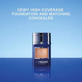 La Prairie Skin Caviar Concealer Foundation SPF 30 in Soft Pearl, navy blue glass bottle with tan foundation visible at top