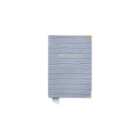 Aspinal of London sky blue croc-embossed leather passport cover with gold corner detail and embossed gold "Passport" text.
