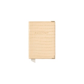 Aspinal of London buttermilk croc-effect leather passport cover with gold embossed lettering and white page edge detail.