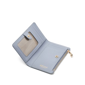 Aspinal of London Sky Blue small bifold wallet open, showing card slots, mirror pocket and zip compartment with gold hardware.
