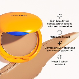 Shiseido Tanning Compact Foundation SPF10 in open compact showing golden-tan shade, with product swatch, highlighting refillable, SPF and