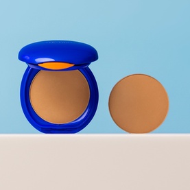 Shiseido UV Protective Compact Foundation SPF30 in blue compact case shown open with separate refill pan in warm beige tone