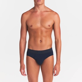 Model wearing Skims Briefs 3Pk in Nimbus Multi, navy blue brief style with clean waistband, minimal design.