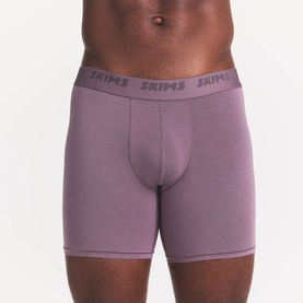 Model wearing Skims Boxers 3Pk in Iris Heather Multi, showing mid-length fit with branded elastic waistband.