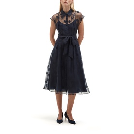 Model wearing Hobbs midnight navy organza midi dress with polka dot pattern, sheer bodice, cap sleeves, and tie waist belt