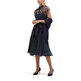 Model wearing Hobbs midnight navy sheer polka dot overlay midi dress with belted waist, styled with navy heels