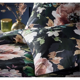 Vantona Bea Duvet Set in multi, dark background with large floral print in pink, cream and green tones, styled on bed