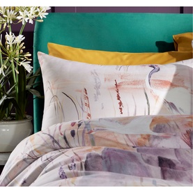 Vantona Oriental Duvet Set in multi, featuring crane and botanical print in soft muted tones, styled with mustard yellow pillows on a teal bed frame.