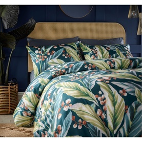 Vantona Twilight Leaves Duvet Set in multi, teal base with tropical leaf and berry print, styled on a double bed with matching pillowcases