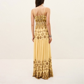 Model wearing Bash yellow maxi dress with gold embroidered floral pattern, sweetheart neckline and spaghetti straps, back view