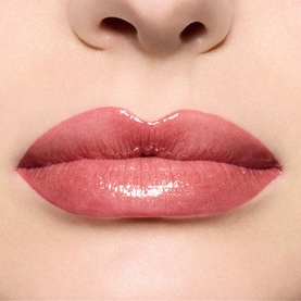 MAC Lip Gloss in Damnsel shade worn on lips, showing a sheer rosy pink glossy finish