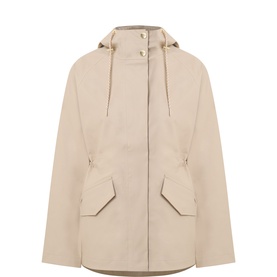 Varley light taupe hooded jacket with drawstring hood, flap pockets, and cinched waist in polyurethane lamination fabric