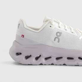On Running trainer in Ivory with lavender CloudTec sole, mesh upper, white laces and small red Swiss flag logo detail.