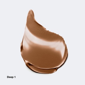 Clinique Daily Calm&trade; Makeup Balm foundation swatch in Deep 1, a warm tan-brown cream texture shown on white background.