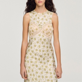 Model wearing Sandro Womens French Dress in olive and ecru floral print, sleeveless with lace panel detail at bust