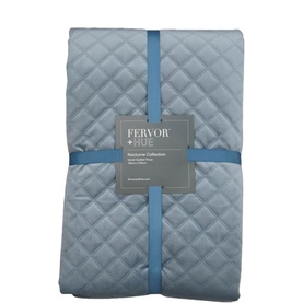 Fervor + Hue Velvet Quilted Throw in Gentle Blue, folded and packaged, showing diamond quilt texture with ribbon tie.