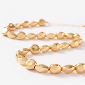 Mint Velvet Beaded Necklace in gold, short style with polished oval beads and adjustable lobster clasp fastening