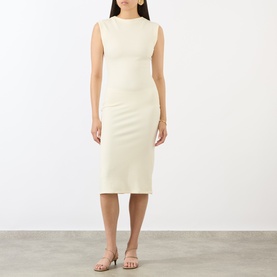 Model wearing Jacquemus off-white sleeveless ribbed midi dress with crew neck and fitted silhouette, styled with strappy sandals.