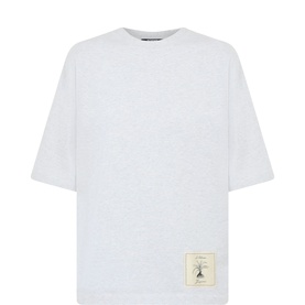 Jacquemus Grey Melange oversized cotton T-shirt with crew neck, short sleeves, and small branded label patch at hem.