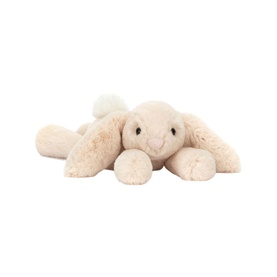 Jellycat plush lying bunny soft toy in cream with floppy ears, pink nose, and fluffy white tail