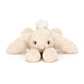 Jellycat cream plush bunny soft toy lying flat with floppy ears, fluffy tail, and embroidered nose detail