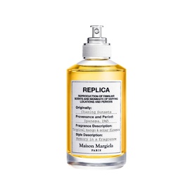 Maison Martin Margiela Replica Chasing Sunsets Eau de Toilette, clear glass spray bottle with white label and golden amber liquid.