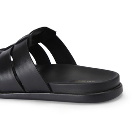 KG by Kurt Geiger black leather men's slide sandals with woven strap detailing and flat sole, close-up side angle