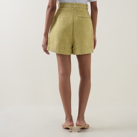 Model wearing Odd Muse Boucl&eacute; Tailored Shorts in chartreuse, high-rise waist, above-the-knee length, rear view, styled with nude heels.