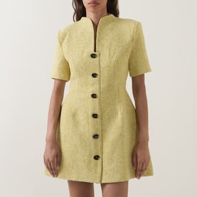 Model wearing Odd Muse Boucl&eacute; Tailored Mini Dress in chartreuse with dark buttons, V-neck collar, short sleeves and flared skirt.