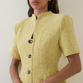 Model wearing Odd Muse Boucl&eacute; Tailored Mini Dress in chartreuse, showing short sleeves, button front, and cinched waist detail.